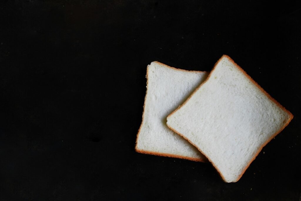 Impact of Diet on Personality, two slices of breads on top of black surface