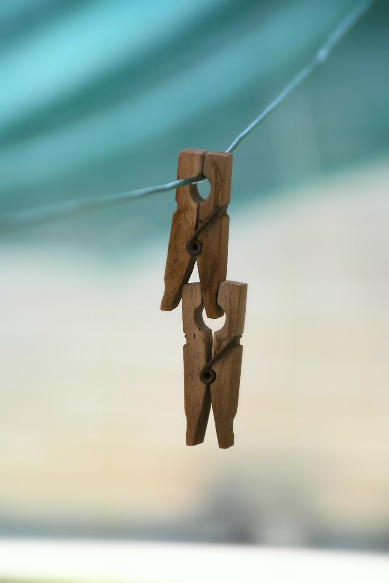 home mortgage, two brown wooden clothes pin on clothes line