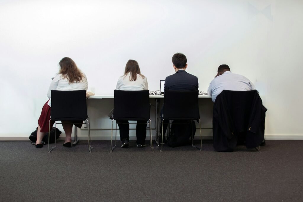 SOC2 audit, a group of people sitting at a table in front of a white wall