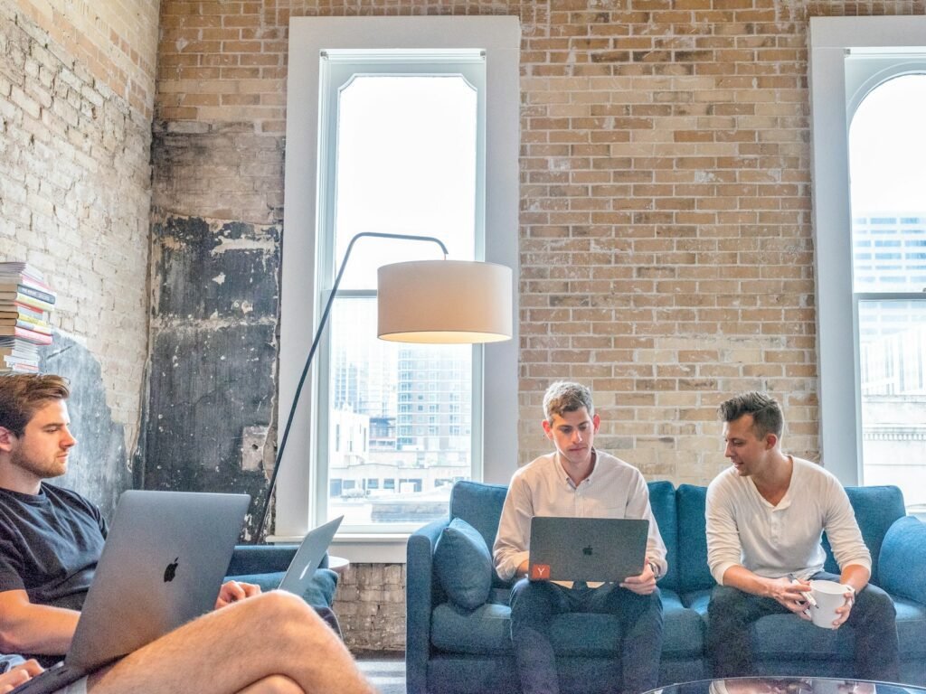 Law Firms, three men using MacBooks