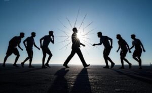 A powerful image of a person breaking free from a group of gossipers, walking confidently towards a ...